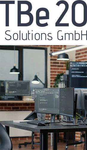 Logo und Bürotisch mit Monitoren